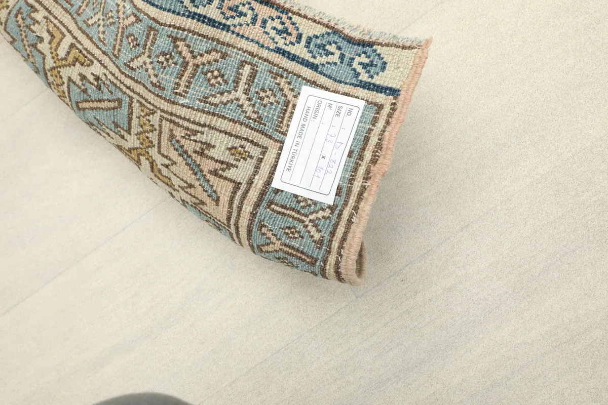 Close-up of the rug's label on the reverse side, showing product details and origin