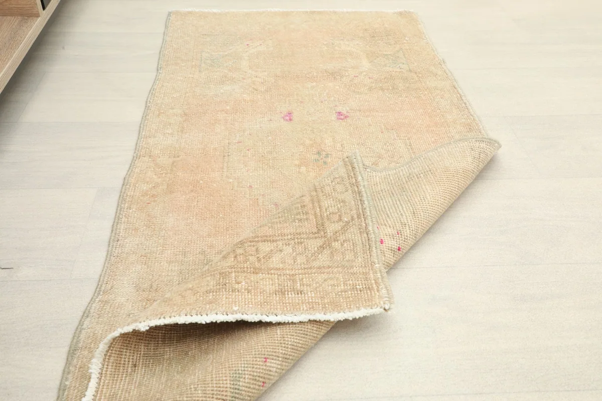 The doormat partially folded, illustrating its flexibility and construction.