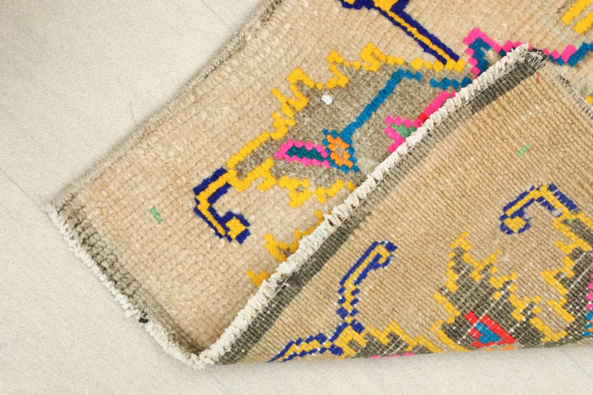 The rug folded to show the thickness and the backside of the hand-knotted wool and cotton foundation.