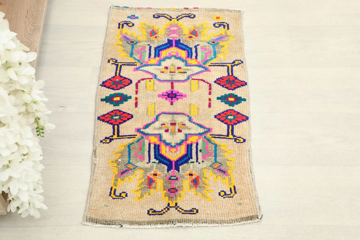 Overhead view showcasing the intricate geometric patterns and vibrant colors of the rug.
