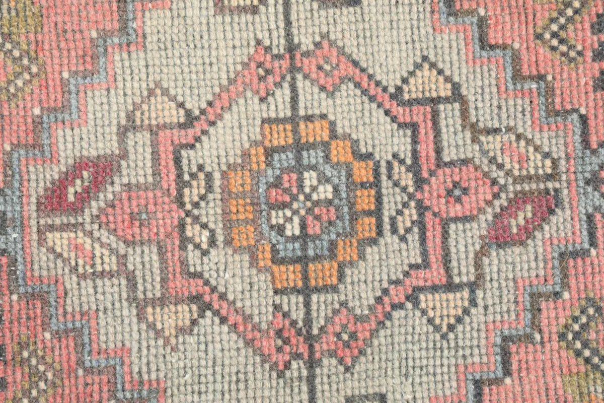 Tight close-up of the intricate geometric patterns and colors within the central medallion.