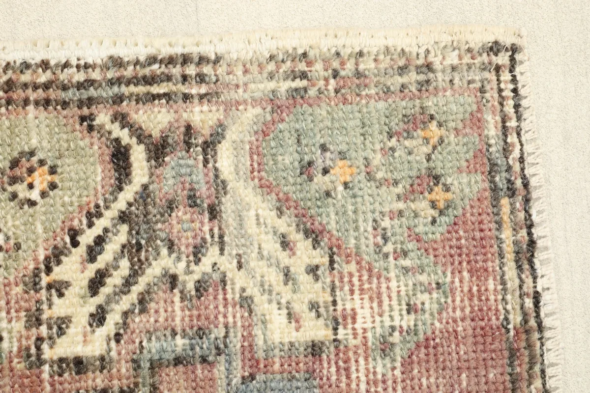 Detail showing the low wool pile and texture of the vintage Anatolian rug.