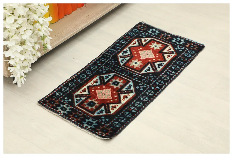 Full top view of the 1x3 navy and red geometric vintage Anatolian doormat