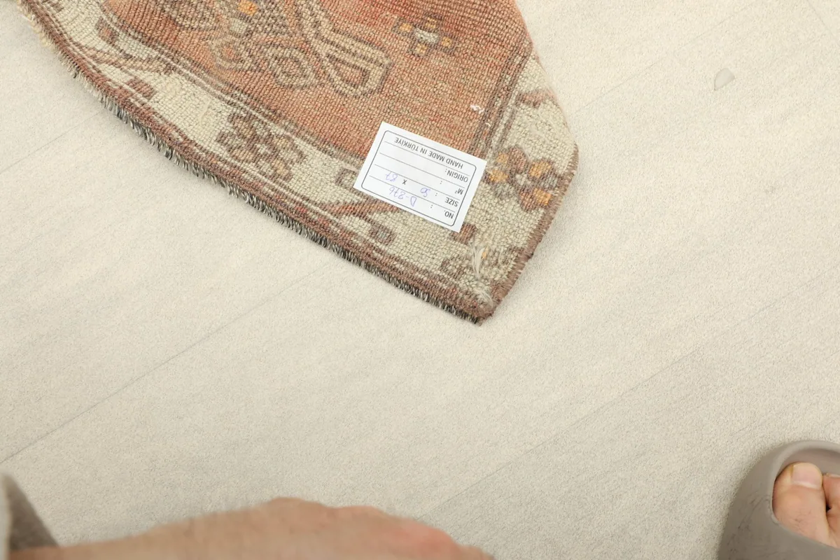 Underside view of the rug, displaying the cotton foundation and fine hand-knotting.