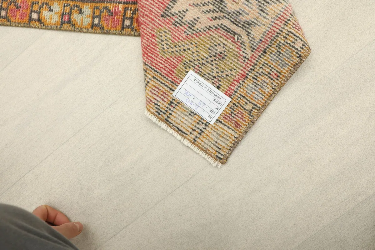 Close-up of the back of the rug, revealing the tight hand-knotted construction and cotton foundation.