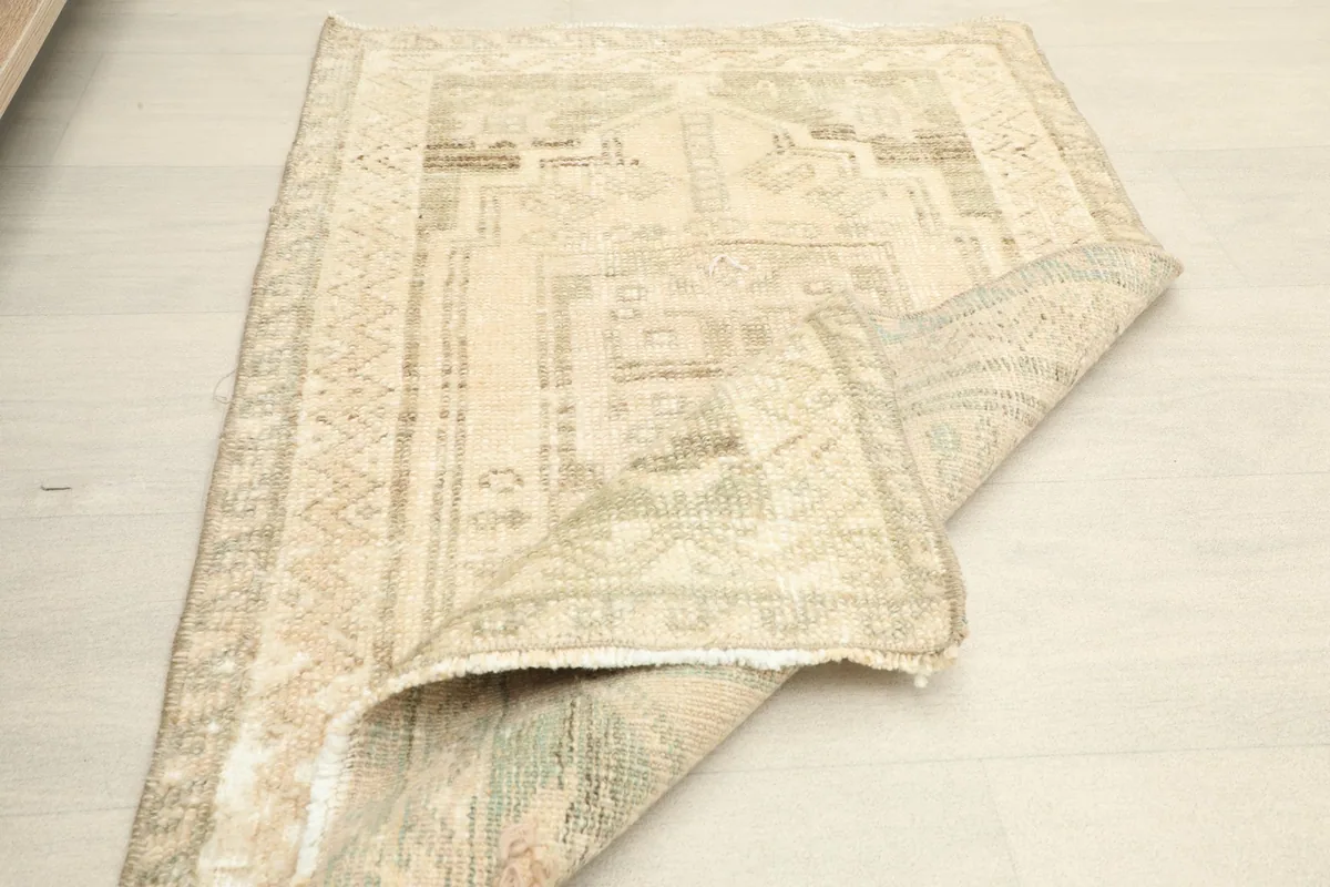 The rug folded to show its flexibility and the consistent weave from front to back.