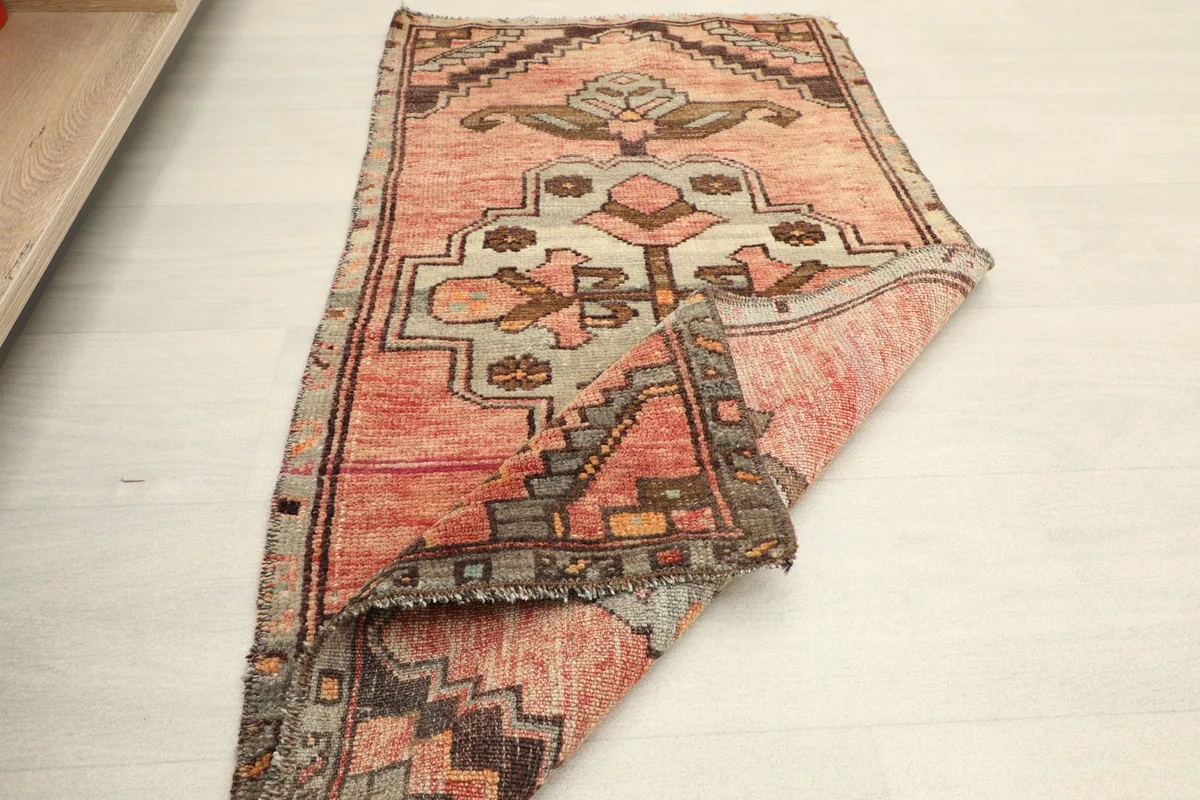 Angled view of the doormat, revealing its full design and the slight variations in the rose coloration.