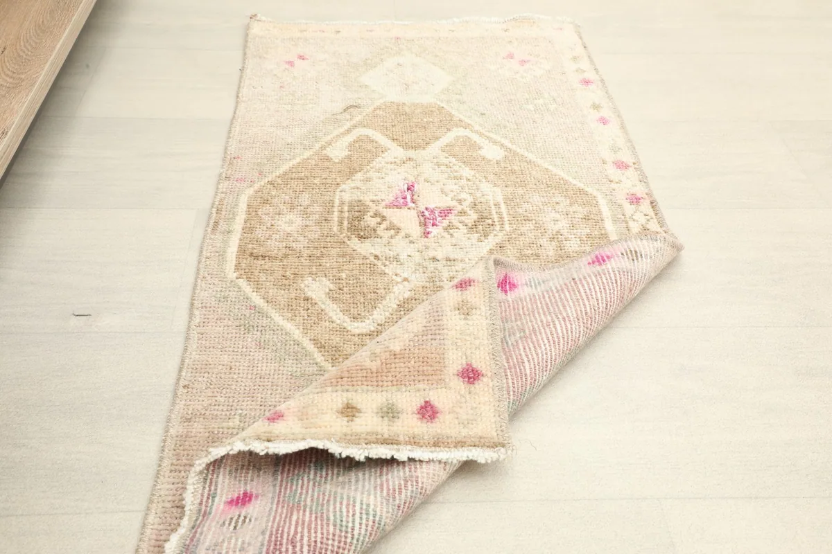 Another folded view of the rug, illustrating its flexibility and the texture of the reverse side.