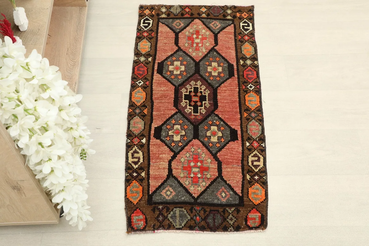 Overhead view showcasing the full geometric pattern and colors of the doormat.