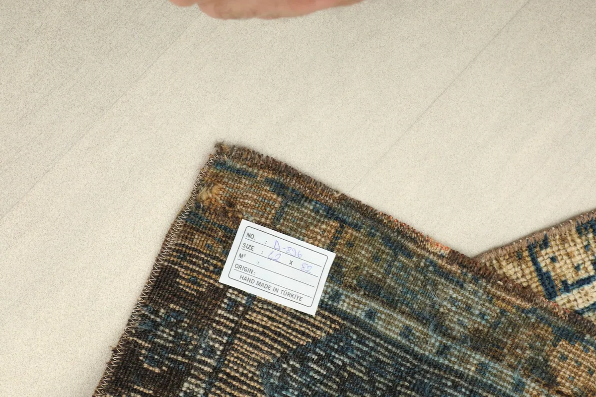 View of the back of the hand-knotted rug, displaying the cotton foundation and fine knotting.