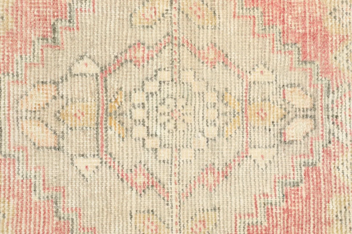 Close-up detail of the central medallion motif and the low pile texture