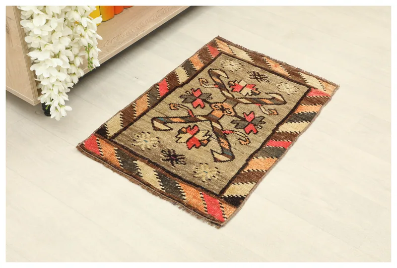Full top view of the 1'7" x 2'4" vintage Anatolian doormat rug on a white background.