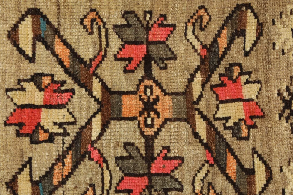 Close-up detail of the central tribal medallion motif and surrounding geometric patterns.