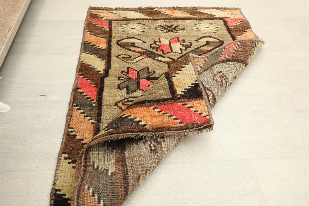 Another folded view of the rug, showing its flexibility and the overall construction.