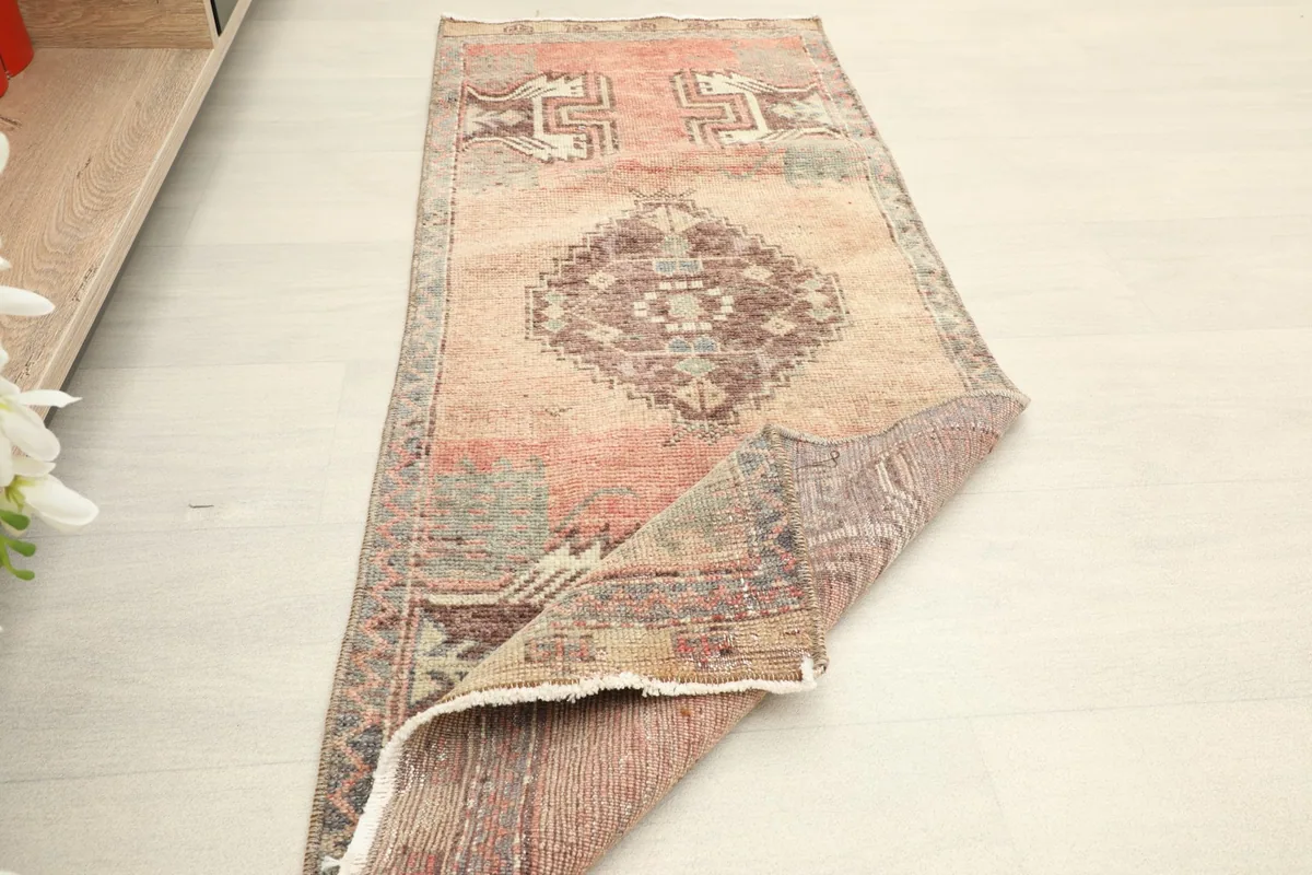Angled full view of the runner on a light floor, showing its overall shape and design
