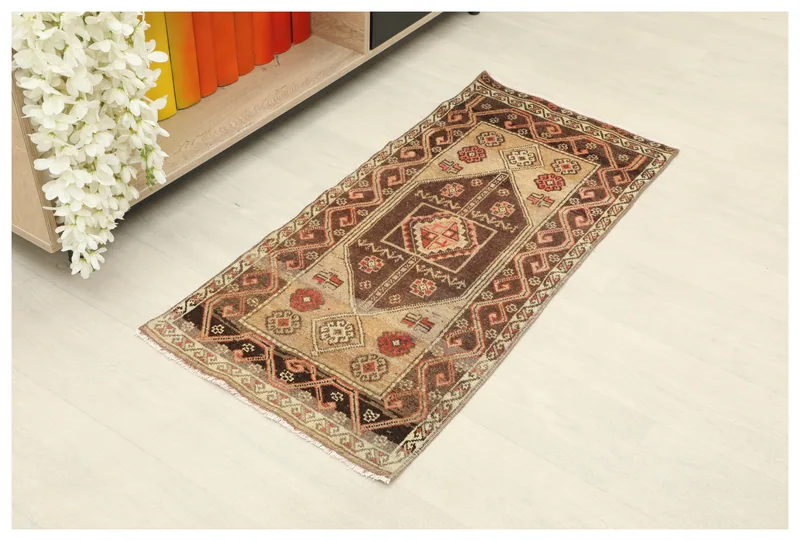 Full overhead view of the brown and beige vintage Anatolian doormat