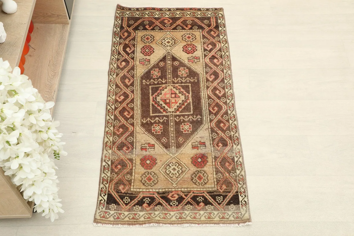 Direct overhead shot showcasing the geometric and tribal patterns of the rug