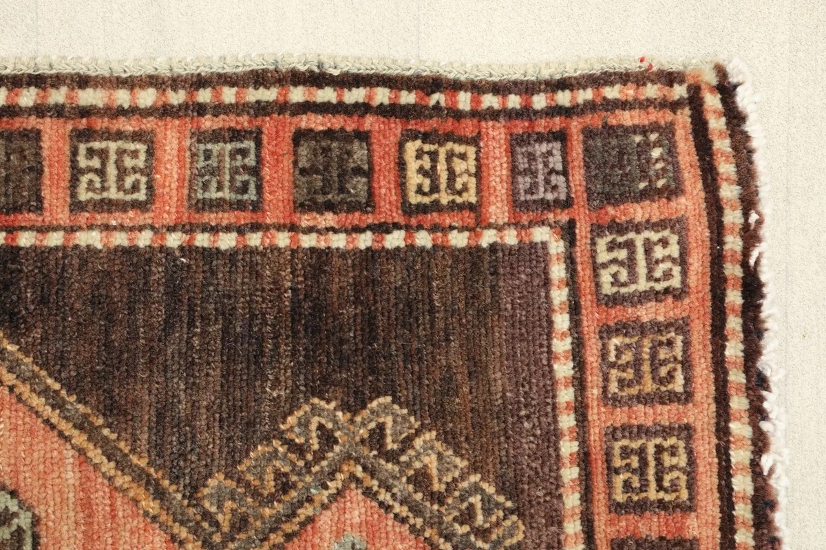 Close-up of the side border, displaying the brown and tan geometric patterns.