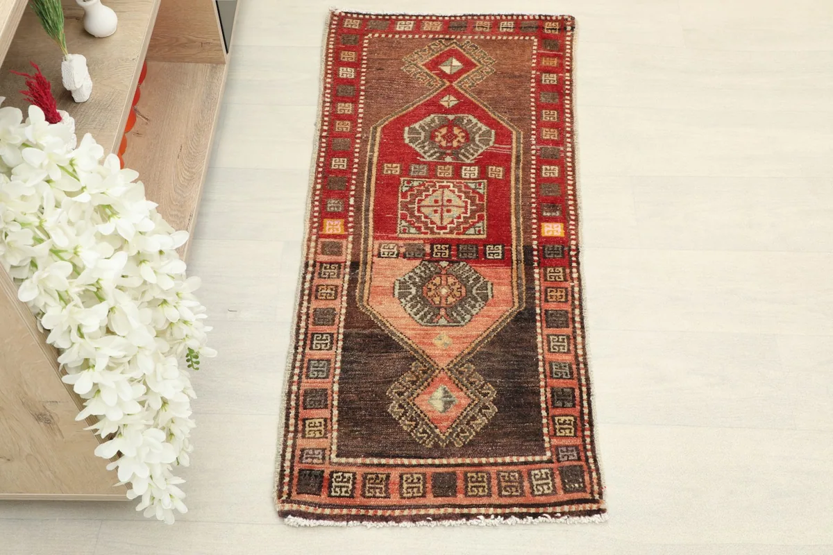 Overhead view of the hand-knotted doormat, highlighting its geometric patterns.