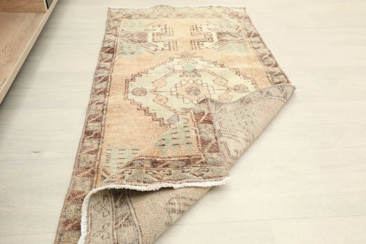 The rug folded to show its flexibility and the texture of the back.