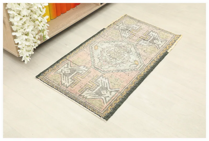 Full top view of the 1'10" x 3'4" vintage Anatolian rug with rose, gray, and green geometric patterns.