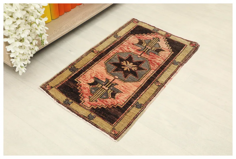 Full top view of the 2x3 vintage rose geometric wool rug on a white background.