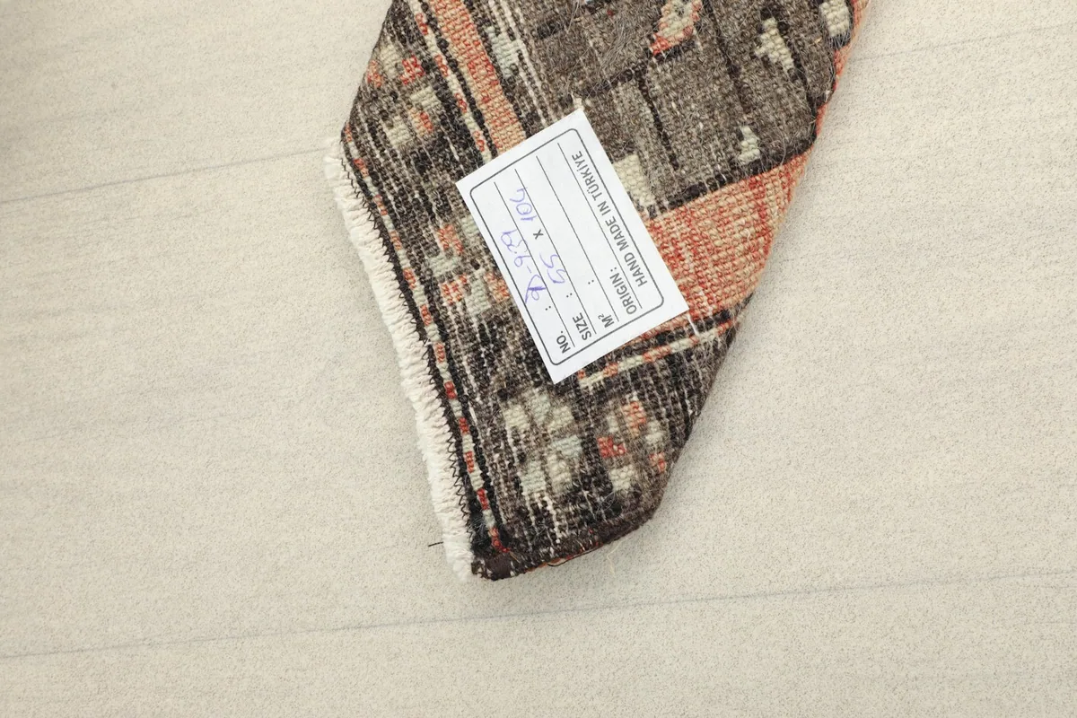 View of the back of the rug, revealing the tightly hand-knotted cotton foundation.