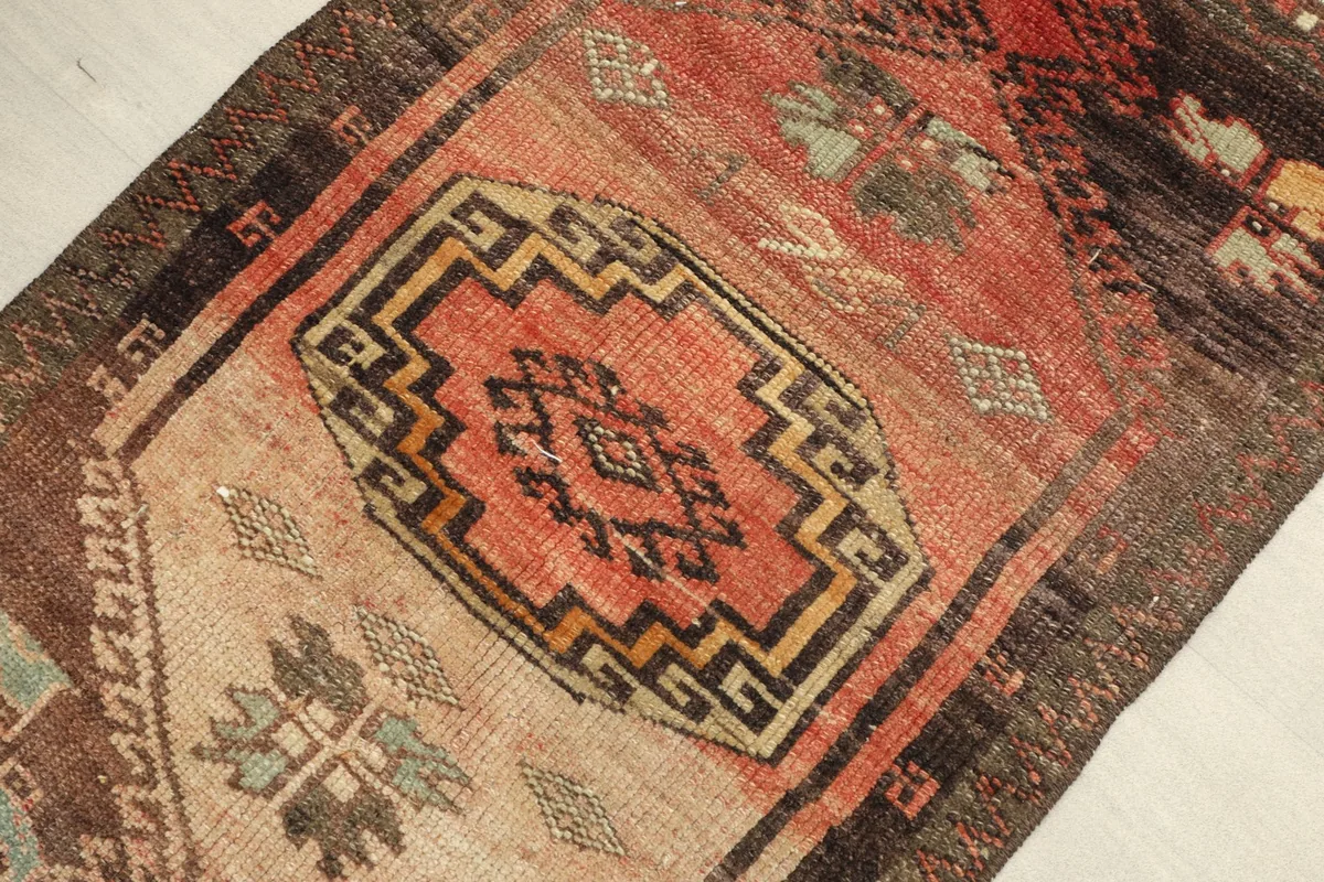 Angled view highlighting the intricate patterns and color variations within the rug's pile.