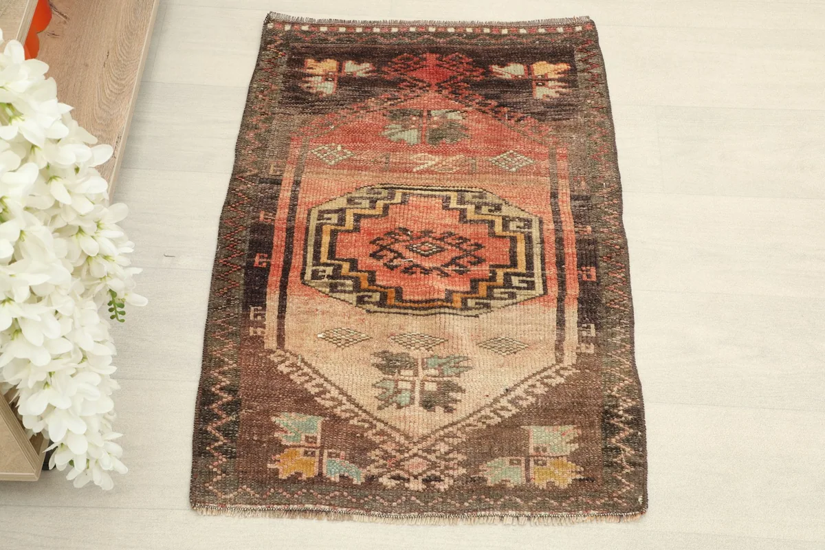 Overhead view showcasing the central geometric medallion and tribal motifs of the rug.