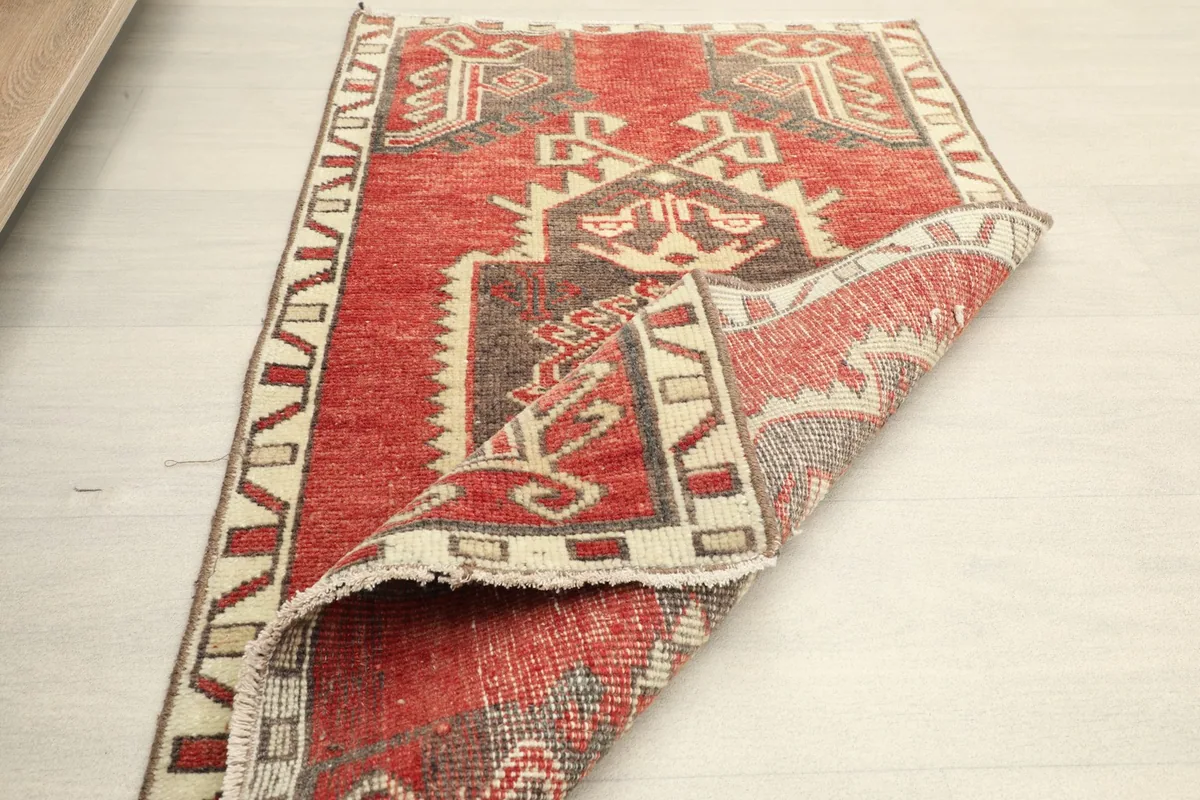 The rug folded to show the flexibility and thickness of the hand-knotted wool
