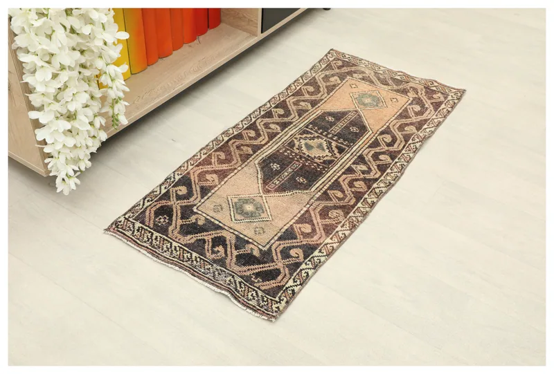 Full overhead view of the 1'7" x 3'6" vintage Anatolian rug on a white background.
