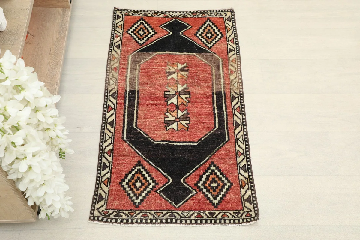 Overhead view of the vintage Anatolian rug, showing its full design and colors.