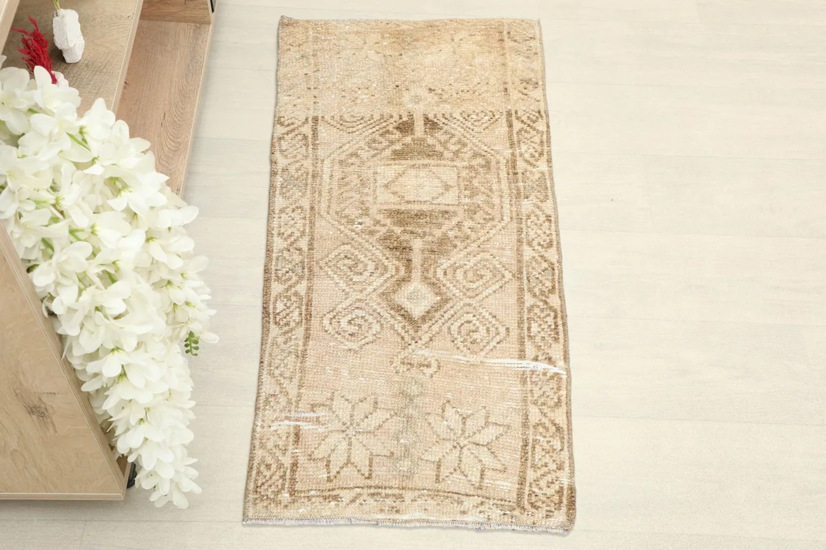 Overhead view of the hand-knotted doormat, showing its full design and shape.
