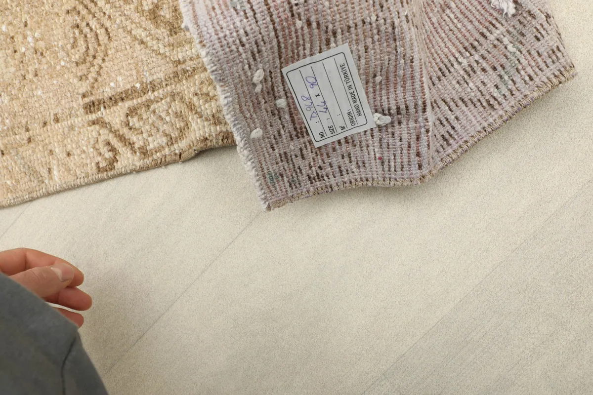 Close-up of the rug's label on the back, confirming its origin and materials.