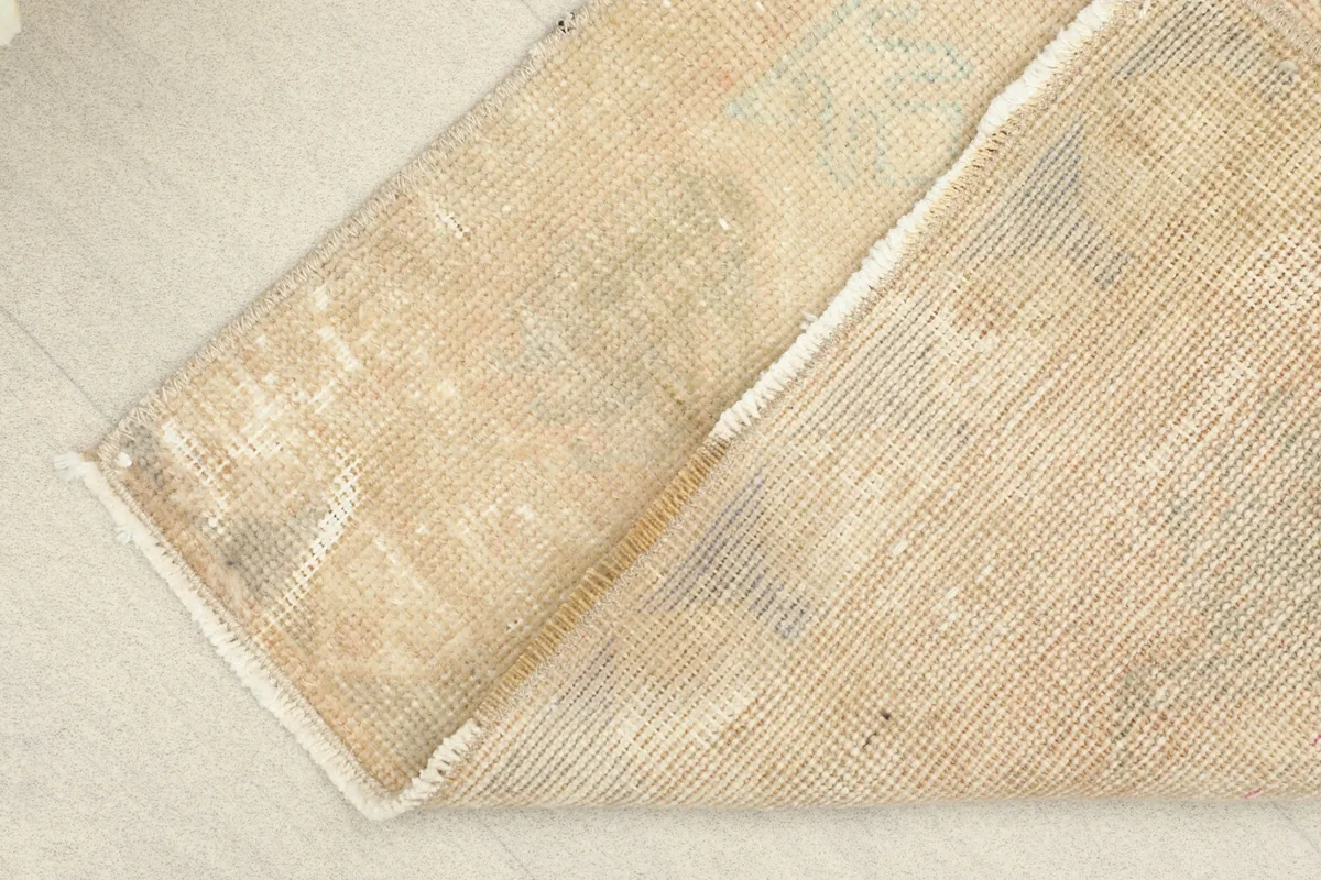 The rug folded to show its flexibility and thickness from an angle.