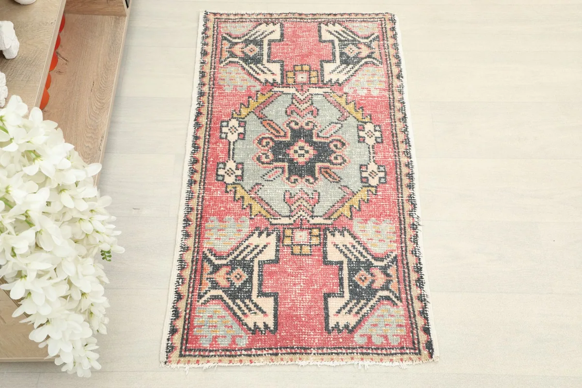 Overhead view of the hand-knotted wool rug, showing its rectangular shape and vibrant colors.
