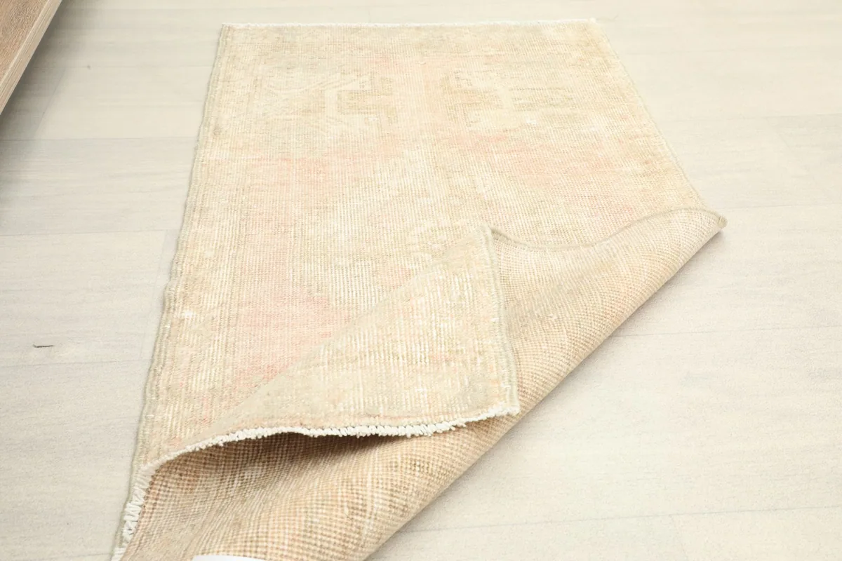 Rug partially folded, illustrating its flexibility and the backing structure