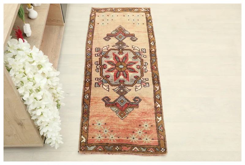 Full top view of the 1'7" x 3'9" vintage Anatolian runner rug on a white background.