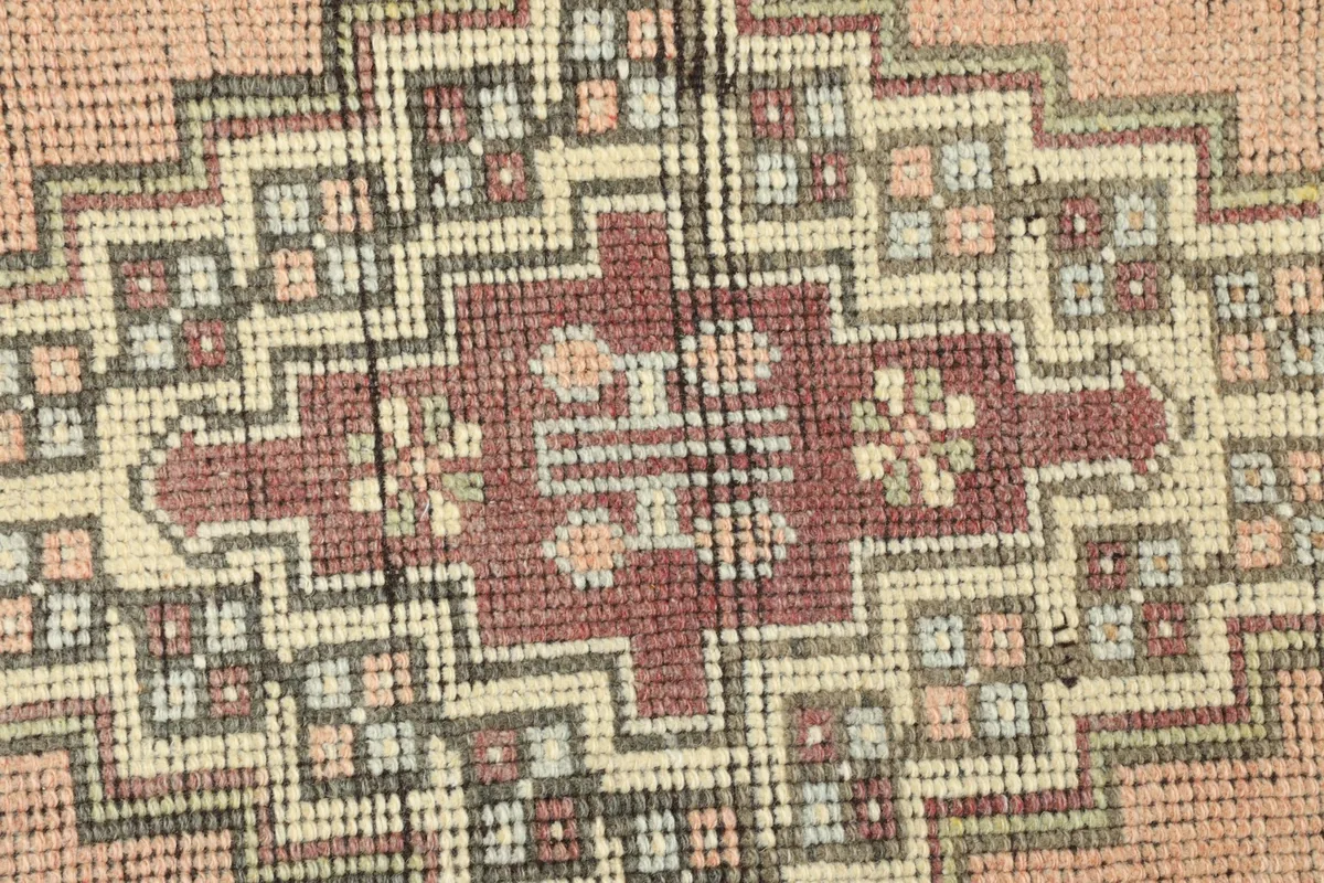 Close-up detail of the intricate geometric patterns within the central medallion.