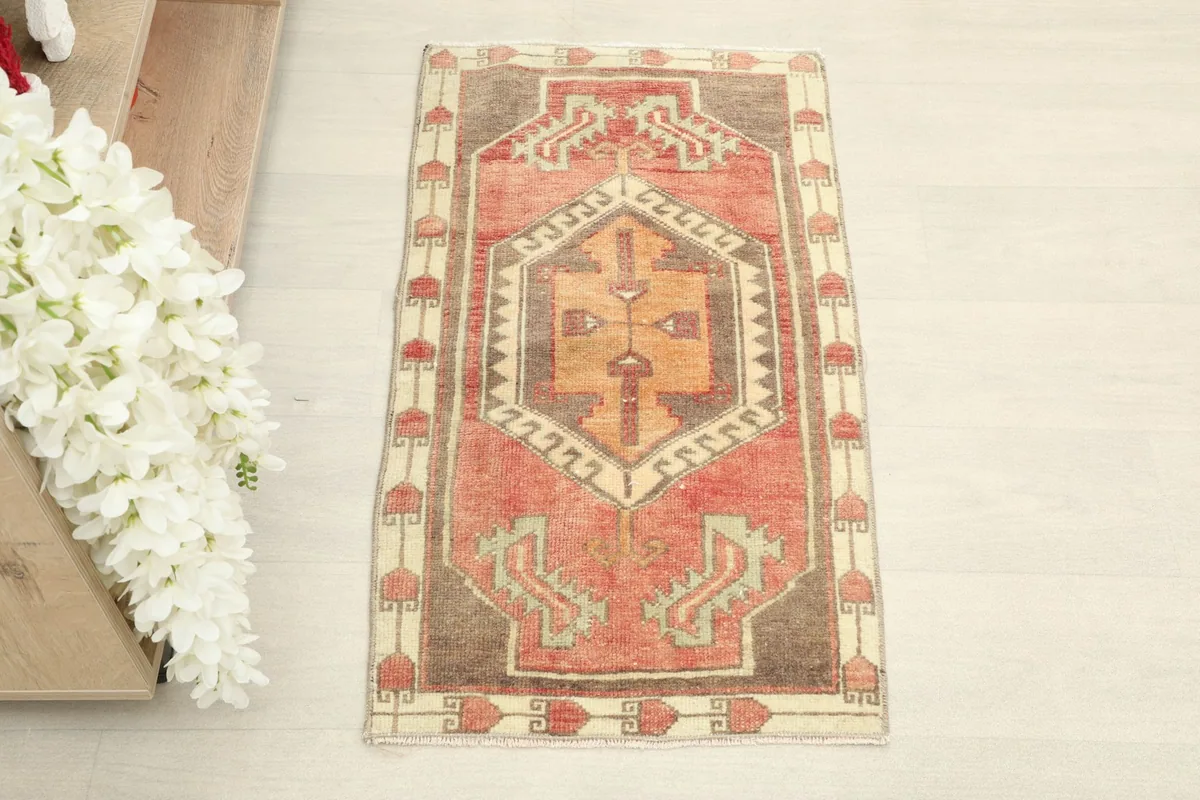 Overhead view of the 2x3 vintage rug, showing its central geometric medallion and borders