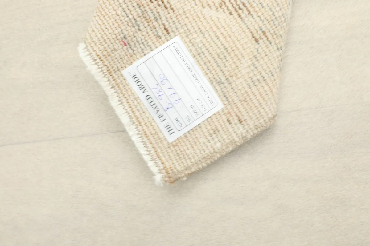 Close-up of the rug's label, confirming its origin and dimensions