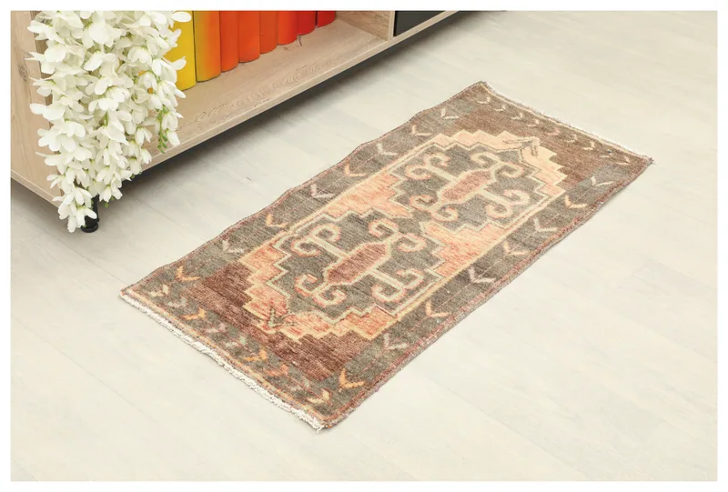 Full top view of the 1'6" x 3'3" brown and orange vintage Anatolian doormat