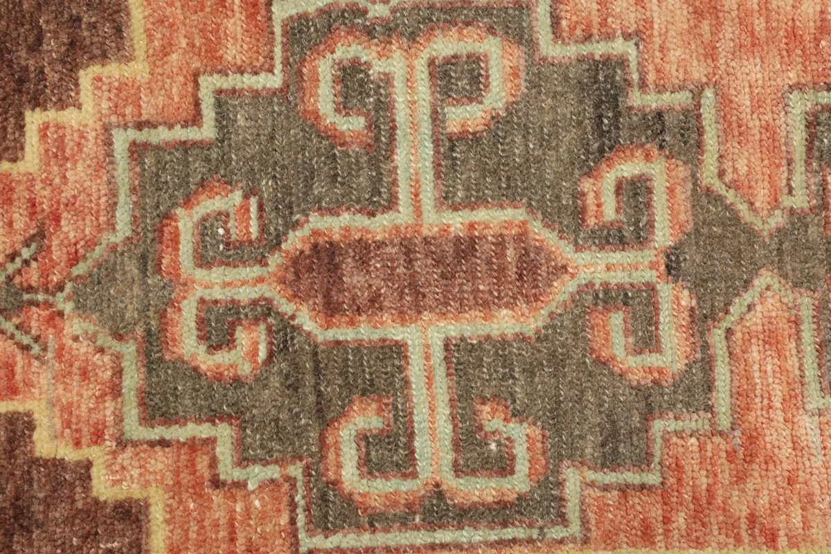Extreme close-up of the central geometric medallion and surrounding patterns