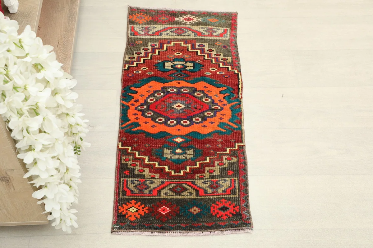 Overhead view of the vintage Anatolian doormat, showing its full length and width.