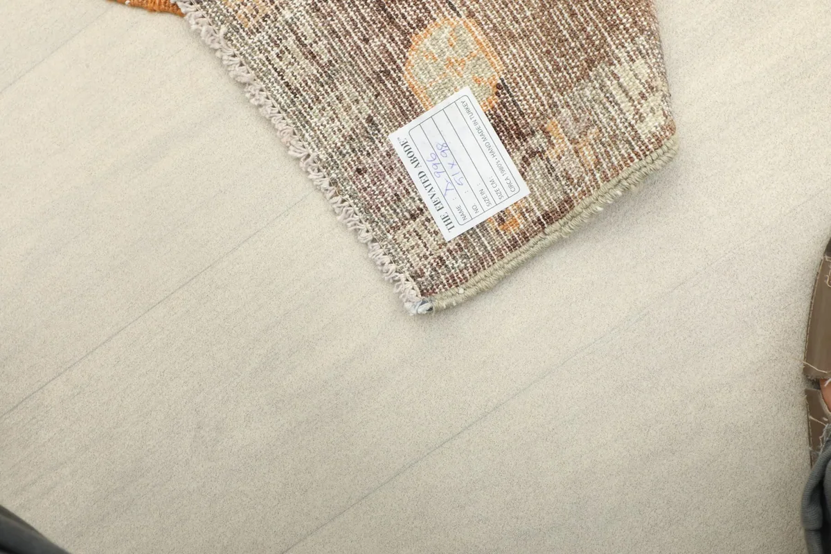 Underside view of the rug, showing the cotton foundation and hand-knotted construction