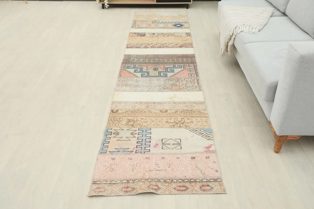 Full length of the runner laid out in a room, viewed from a slight angle towards a sofa