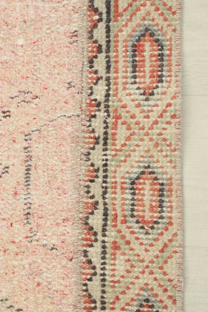 Close-up of the side edge of a rose panel, showing the subtle border and texture
