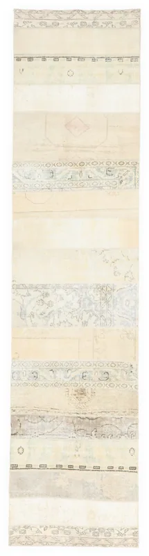 Full top view of the 2'7" x 11'3" vintage Anatolian patchwork runner on a white background.