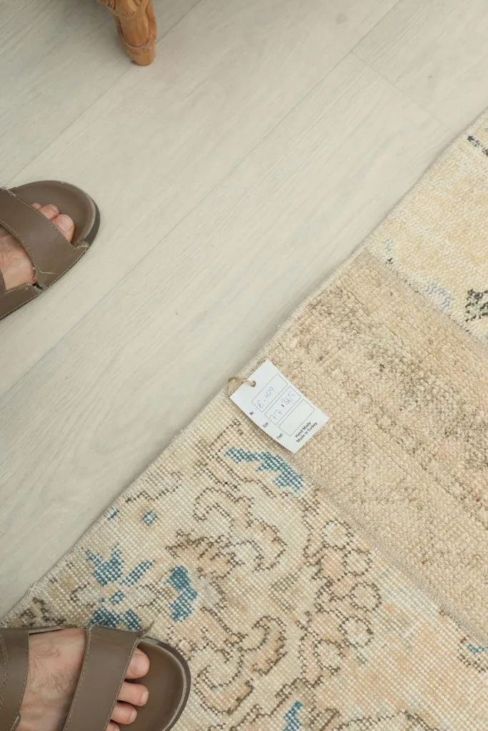 Overhead view of a section of the runner with a tag, showing scale next to feet