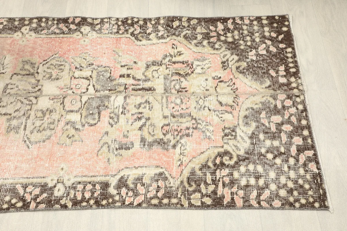 Angled view of the other end of the runner, showing the overall distressed aesthetic